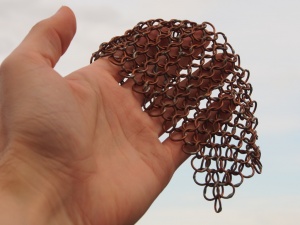 Patch of chain maille held in hand.JPG